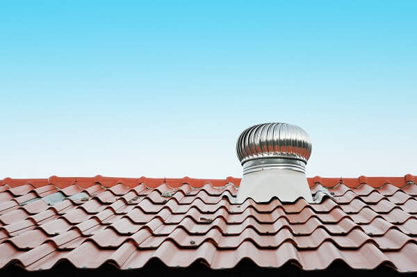 A vent fan releases heat from an attic
