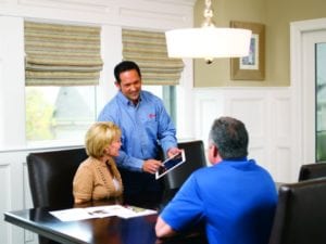 A representative discusses options with Lantana homeowners