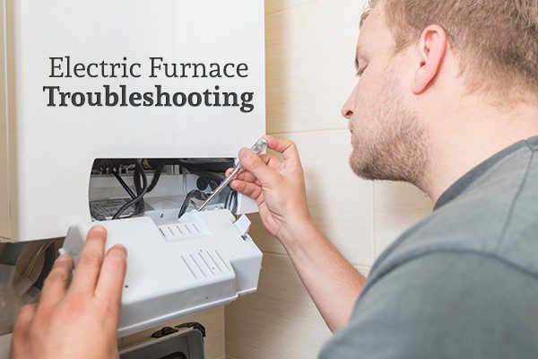 A man fixing an electric furnace with the words "Electric Furnace Troubleshooting"