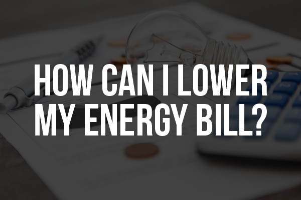 The words "how can I lower my energy bill" on a picture of a calculator.